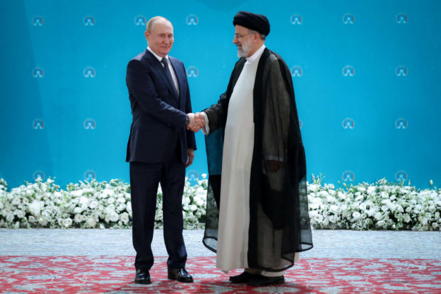FILE PHOTO: Russian President Vladimir Putin and Iranian President Ebrahim Raisi meet before a summit of leaders from the guarantor states of the Astana process, designed to find a peace settlement in the Syrian conflict, in Tehran, Iran July 19, 2022.