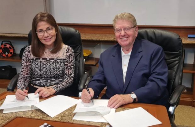 In the Photo, Chairwoman Isabelita P. Mercado of IPM Holdings and Chairman George Weiss of Stellar3 flash smiles while preparing to sign the agreement on a waste-to-fuel conversion project in the Philippines.