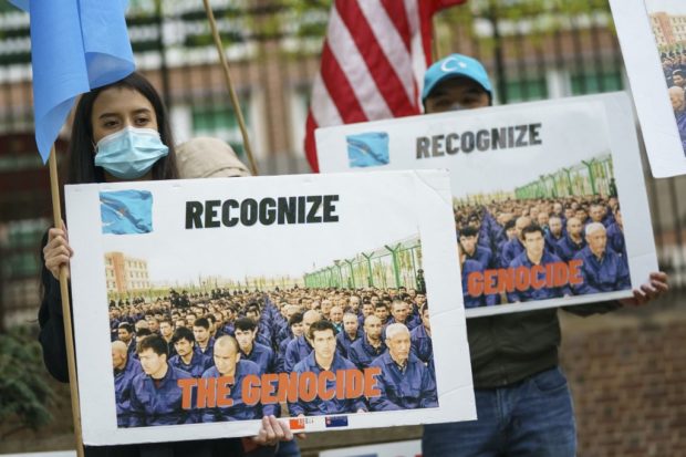 WASHINGTON, DC - APRIL 16: Supporters of the East Turkistan National Awakening Movement rally in front of the British Embassy ahead of an April 22 vote in the British House of Commons on whether or not to declare that a genocide is underway in Xinjiang province and Chinas treatment of the Uyghur Muslims on April 16, 2021 in Washington, DC.