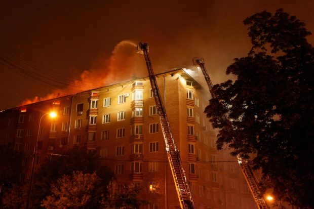 Russian firefighters use helicopter to douse Moscow building blaze