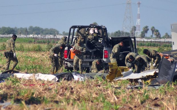 Soldiers of the Mexican Army work at the site of a Navy helicopter crash near the airport of Los Mochis, Sinaloa State, Mexico on July 15, 2022