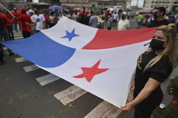 People protest against alleged corruption cases in President Laurentino Cortizo's government, on the second anniversary of his administration in front of the National Assembly in Panama City, on July 1, 2021.