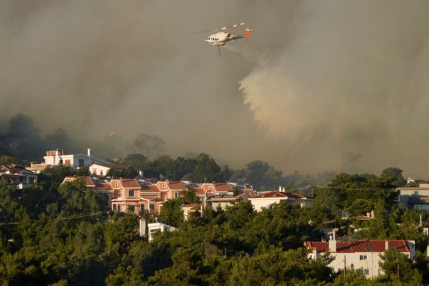 Greek wildfire rages near Athens; homes, hospital evacuated