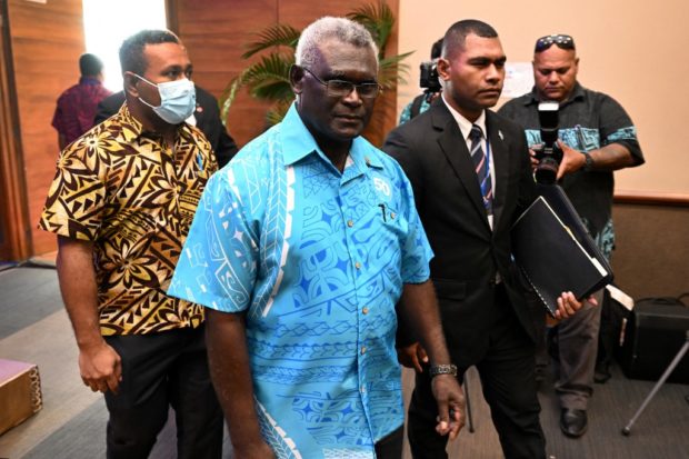 Prime minister of the Solomon Island Manasseh Sogavare (C) arrives for the opening remarks of Pacific Islands Forum (PIF) in Suva on July 12, 2022 (Photo by William WEST / AFP)