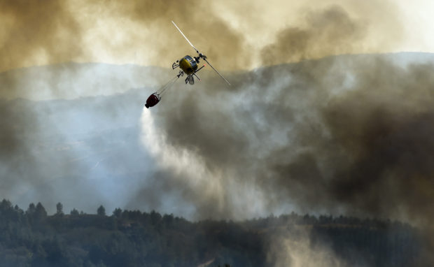 Spain wildfire forces evacuations, destroys land