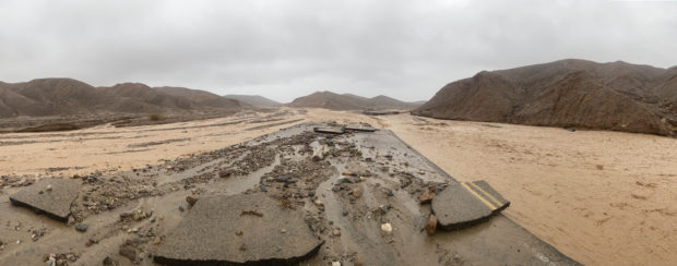 This handout panoramic image courtesy of Death Valley National Park Service shows monsoonal rain flooding Mud Canyon in Death Valley National Park, California on August 5, 2022. - Intense and rare rainfall in California's famous Death Valley caused major flooding Friday, trapping approximately 1,000 people inside the national park. "Unprecedented amounts of rainfall caused substantial flooding," the National Park Service said in a statement, adding that "there are approximately 500 visitors and 500 staff currently unable to exit the park," which is located in the desert in the state's southeast. Approximately 60 cars were buried under several feet of debris at an inn. (Photo by NATIONAL PARK SERVICE / AFP) / RESTRICTED TO EDITORIAL USE - MANDATORY CREDIT "AFP PHOTO / HANDOUT / National Park Service " - NO MARKETING - NO ADVERTISING CAMPAIGNS - DISTRIBUTED AS A SERVICE TO CLIENTS