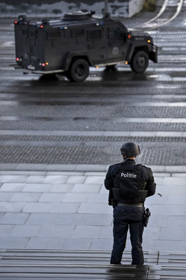 A heavily armed policeman stands outside the courthouse during the trial of four persons, including an Iranian diplomate and Belgian-Iranian couple, before the Antwerp criminal court in Antwerp, on February 4, 2021.