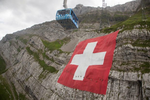 World’s biggest Swiss flag unfurled on Alpine cliff