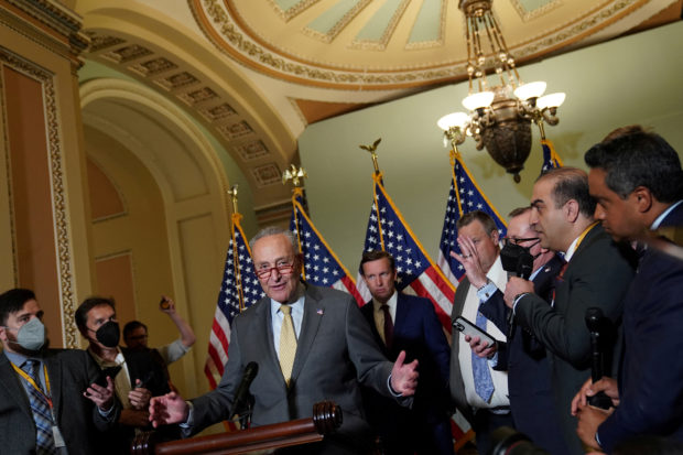 FILE PHOTO: U.S. Senate Majority Leader Chuck Schumer (D-NY) speaks to reporters after the weekly senate party caucus luncheons at the U.S. Capitol in Washington, U.S., June 14, 2022. REUTERS/Sarah Silbiger/File Photo