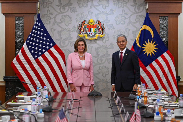 U.S. House of Representatives Speaker Nancy Pelosi and Malaysia's Parliament Speaker Azhar Azizan Harun pose for photographs during their meeting at Malaysian Houses of Parliament in Kuala Lumpur, Malaysia, August 2, 2022. 