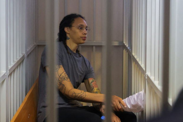 U.S. basketball player Brittney Griner, who was detained at Moscow's Sheremetyevo airport and later charged with illegal possession of cannabis, sits inside a defendants' cage after the court's verdict in Khimki outside Moscow, Russia August 4, 2022. REUTERS/Evgenia Novozhenina/Pool