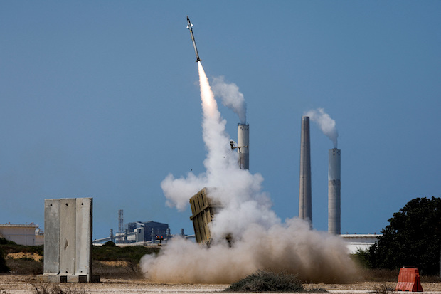 An Iron Dome anti-missile system fires an interceptor missile as a rocket is launched from the Gaza Strip towards Israel. STORY: Israel, Palestinians agree truce from Sunday evening