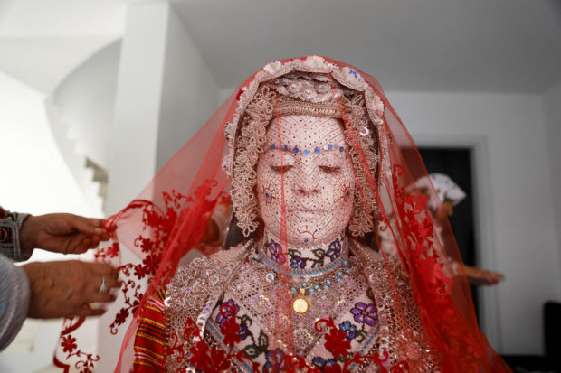 Face paint and folklore transform Chicago bride for traditional wedding in Kosovo