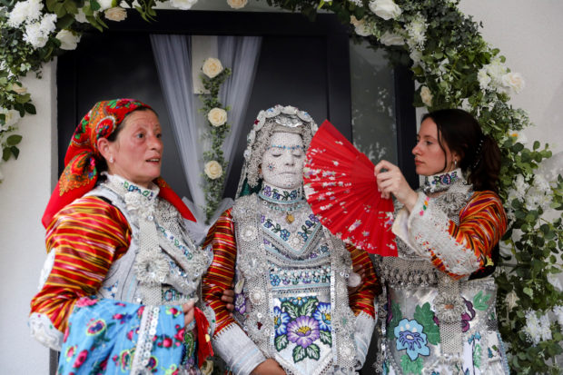 Face paint and folklore transform Chicago bride for traditional wedding in Kosovo
