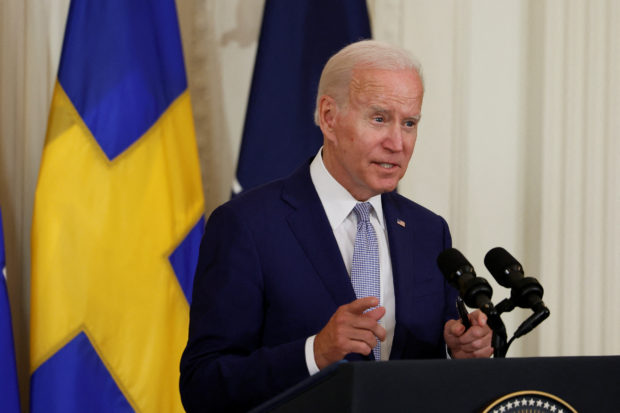 U.S. President Joe Biden delivers remarks and signs documents endorsing Finland's and Sweden's accession to NATO, in the East Room of the White House, in Washington, U.S., August 9, 2022. REUTERS/Evelyn Hockstein