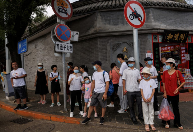 Several cities in China add COVID-19 curbs as millions still under lockdown