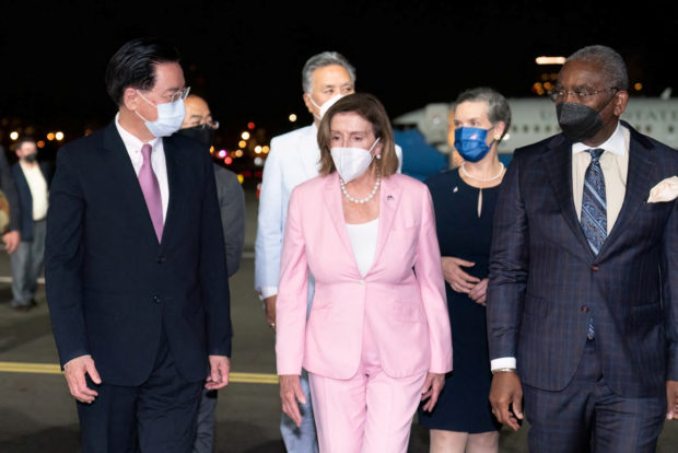 Taiwan Foreign Minister Joseph Wu welcomes U.S. House of Representatives Speaker Nancy Pelosi at Taipei Songshan Airport in Taipei, Taiwan August 2, 2022. Taiwan Ministry of Foreign Affairs/Handout via REUTERS