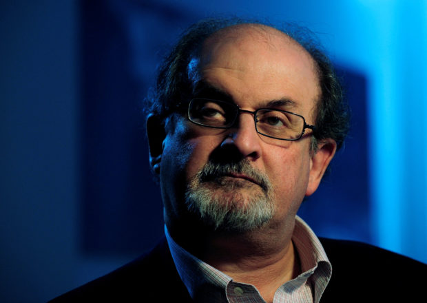 British author Salman Rushdie listens during an interview with Reuters in London April 15, 2008.  REUTERS/Dylan Martinez/File Photo
