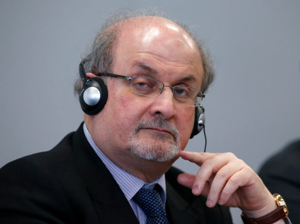 FILE PHOTO: Author Salman Rushdie listens during the opening news conference of the Frankfurt book fair, Germany October 13, 2015. REUTERS/Ralph Orlowski/File Photo