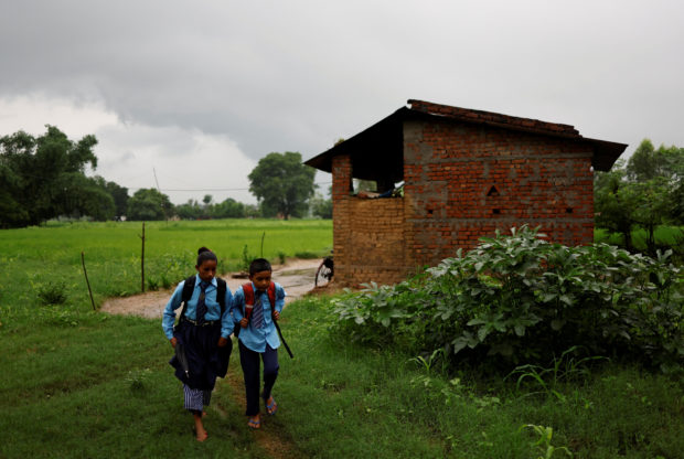 Nepali woman’s quest to learn takes her back to school with son