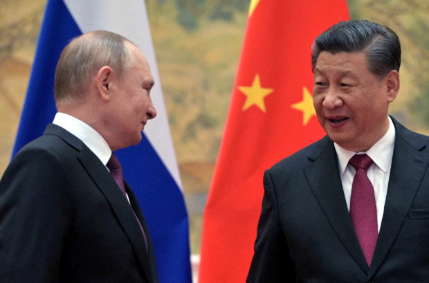 FILE PHOTO: Russian President Vladimir Putin meets with Chinese President Xi Jinping in Beijing, China, February 4, 2022. Sputnik/Aleksey Druzhinin/Kremlin via REUTERS
