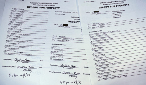 FILE PHOTO: The three page itemized list of property seized in the execution of a search warrant by the FBI at former President Donald Trump's Mar-a-Lago estate is seen after being released by the U.S. District Court for the Southern District of Florida in West Palm Beach, Florida, U.S. August 12, 2022. REUTERS/Jim Bourg