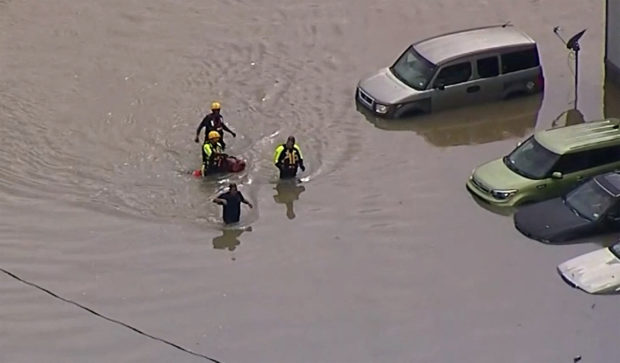 Dallas woman dies in car as floods lash region