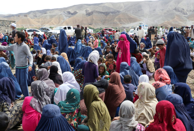 FILE PHOTO: Displaced Afghan families spend time together after the heavy flood in the Khushi district of Logar, Afghanistan, August 21, 2022. REUTERS/Stringer/