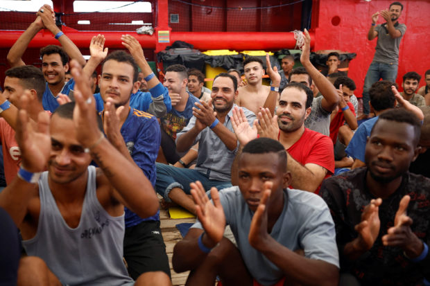 Rescue boat celebrates as stranded migrants given OK to disembark in Italy