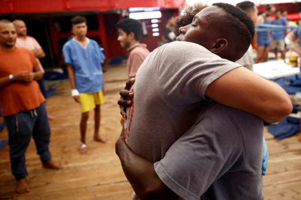 Rescue boat celebrates as stranded migrants given OK to disembark in Italy