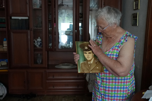Taisia Herasymenko holds a picture of her son, Roman Herasymenko, who was shot and killed during the Russian occupation of Borodianka. STORY: Mother seeks justice for son in Ukraine: 'He walked away and they shot him'