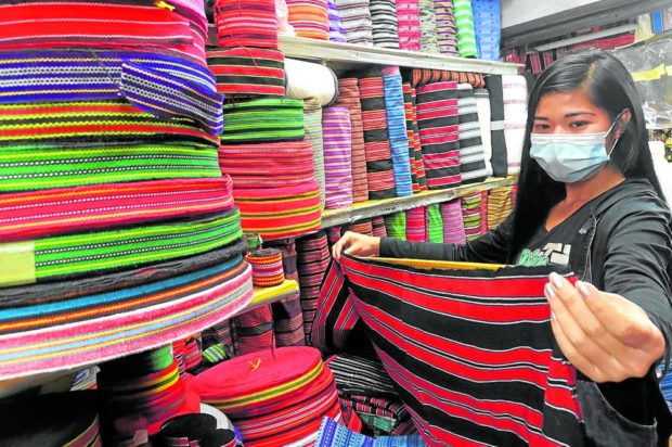 Stalls at Baguio City public market sell textiles with indigenous Cordillera patterns and designs. The Philippine Textile Research Institute is putting up a national registry for traditional handloom weavers to protect them from counterfeit products being marketed as authentic Cordillera fabrics. STORY: Native textiles soon to get security features vs fakes