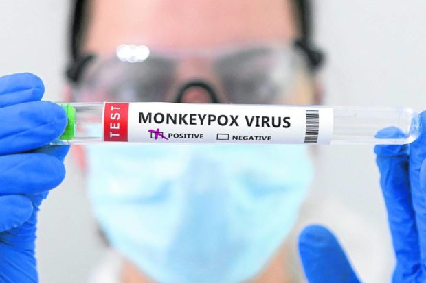 FILE PHOTO: Test tubes labelled "Monkeypox virus positive" are seen in this illustration taken May 23, 2022. REUTERS/Dado Ruvic/Illustration