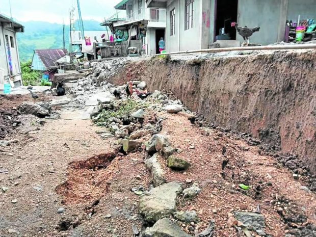 The magnitude 7 earthquake that hit northern Luzon on July 27 pushes the ground apart at Sitio (subvillage) Tatabra-an in Barangay Sacasacan, Sadanga town, Mountain Province, with portions of the road sinking by at least a meter, as shown in this photo taken on Aug. 7. STORY: 5 families flee as ground sinks in Mountain Province village after earthquake. STORY: 5 families flee as ground sinks in Mountain Province village after earthquake