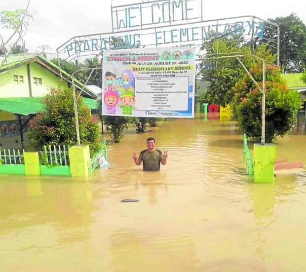 Floodwater swamps the grounds of an elementary school in Pagalungan, Maguindanao