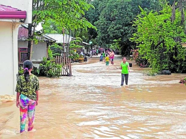 Residents of Datu Montawal, Maguindanao, come out of their homes as floodwater rises due to heavy downpour this week in the nearby provinces of Cotabato and Bukidnon, causing rivers flowing through Maguindanao communities to swell. STORY: Maguindanao floods displace 15,000 families