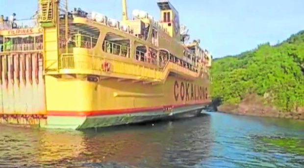 The MV Filipinas Cebu stuck in shallow waters off Concepcion, Iloilo. STORY: Ferry runs aground after helmsman fell asleep – PCG