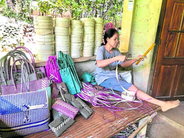 STORY: Betty Carolino, 54, is among the residents of Santiago Island who weave bags out of buri leaves