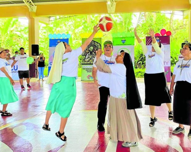 Nuns vie for possession of the ball during the Vianney Cup. STORY: In Borongan, nuns play hoops (not mahjong)