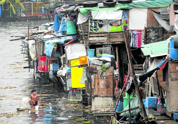 A resident fishes plastic bottles and packaging in a river in Tondo, Manila, so these can be sold later to junk shops. The pandemic-induced economic slowdown has forced many Filipinos out of jobs, resulting in more poor families, according to latest government data. STORY: Pandemic pushes 2.3 million Filipinos into poverty