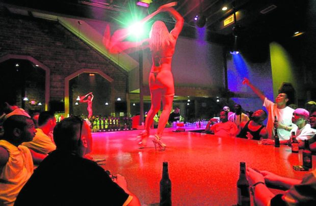 In this September 2005 file photo, a stripper performs at the Deja Vu Showgirls Club