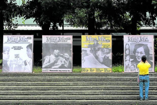 A visitor takes photos of blown up images of Mr. & Ms. magazine covers at Bantayog ng mga Bayani in Quezon City on Saturday. The political edition of the women’s magazine, published by Eugenia Apostol and edited by Letty Jimenez-Magsanoc, was a popular reading fare in the twilight of the Marcos dictatorship. STORY: Rights activists vow to protect Ninoy’s place in history