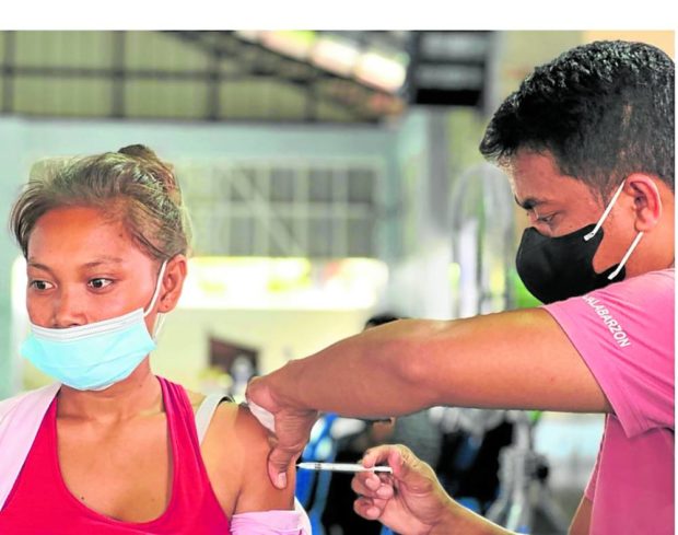 ONE TOO FEW This Sama-Bajau native in Lucena City is among the latest to be inoculated on Aug. 17 and one of just over 120 of the 1,000 members of the indigenous peoples group who agreed to be vaccinated against COVID-19. —PHOTO FROM THE DEPARTMENT OF HEALTH CALABARZON FACEBOOK