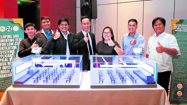 Researchers from the University of San Carlos in Cebu City show the ventilation system. STORY: DOST backs cheap school ventilation system