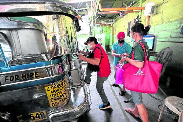 Passengers boarding a jeepney. STORY: Commuter advocacy group OK with P2 jeepney fare hike
