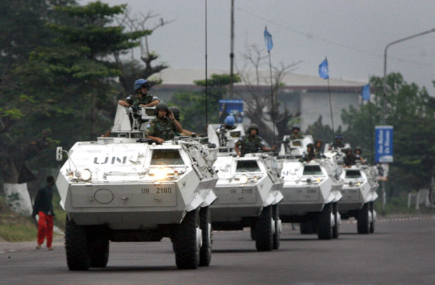 United Nations peacekeeping troops patrol the streets in armoured personnel carriers on election day in Democratic Republic of Congo's capital Kinshasa July 30, 2006. REUTERS/Finbarr O'Reilly/File Photo