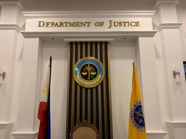 Department of Justice logo. STORY: DOJ junks trafficking raps vs 3 POGOs