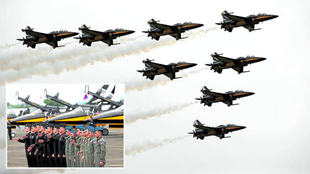 Members of the Republic of Korea Air Force’s 53rd Air Demonstration Group, also known as the Black Eagles, join Philippine Air Force pilots (inset) after an air show at Basa Air Base in Floridablanca, Pampanga, on Monday, to highlight the strong relations between the two countries. STORY: Korean jets put on a show in Pampanga