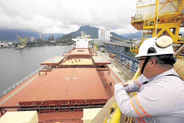Man looking over the sea at a dock. STORY: Compensation lawsuits cutting jobs for seafarers