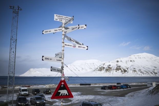 A warning sign depicting a polar bear is erected at the side of a road outside Longyearbyen airport on May 2, 2022, in Svalbard Archipelago, northern Norway. (Photo by Jonathan NACKSTRAND / AFP)